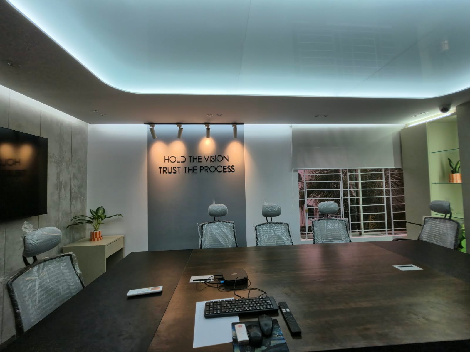 IMPIT conference room with the Trust the Process wall